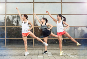 Athlete girls training aerobic outdoor